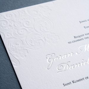 Wedding invitation blind debossed, letterpress printed and silver foiled