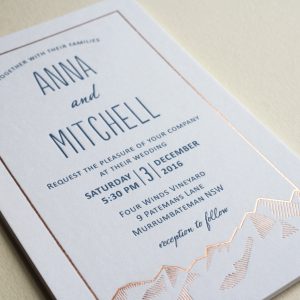 Letterpress printed and rose gold foiled wedding invitation