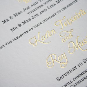 Wedding invitation letterpress printed in black and gold